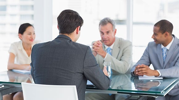 preparing for senior interview professionals in a senior interview around a table