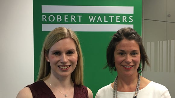 katherine allwood and jennifer atkinson standing in front of green walter walters sign