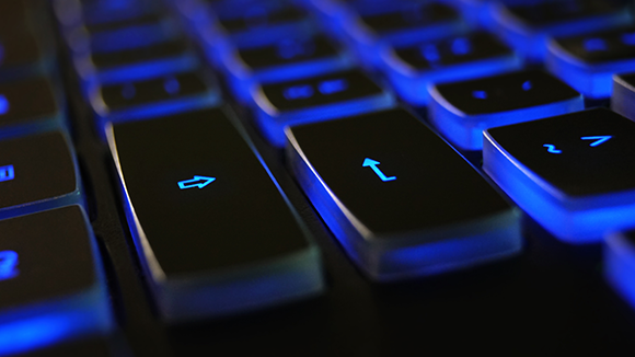 close up black blue keyboard with Robert Walters Technology text