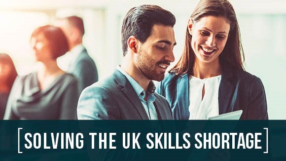 Solving the UK Skills Shortage banner image with green bar and two people discussing research results