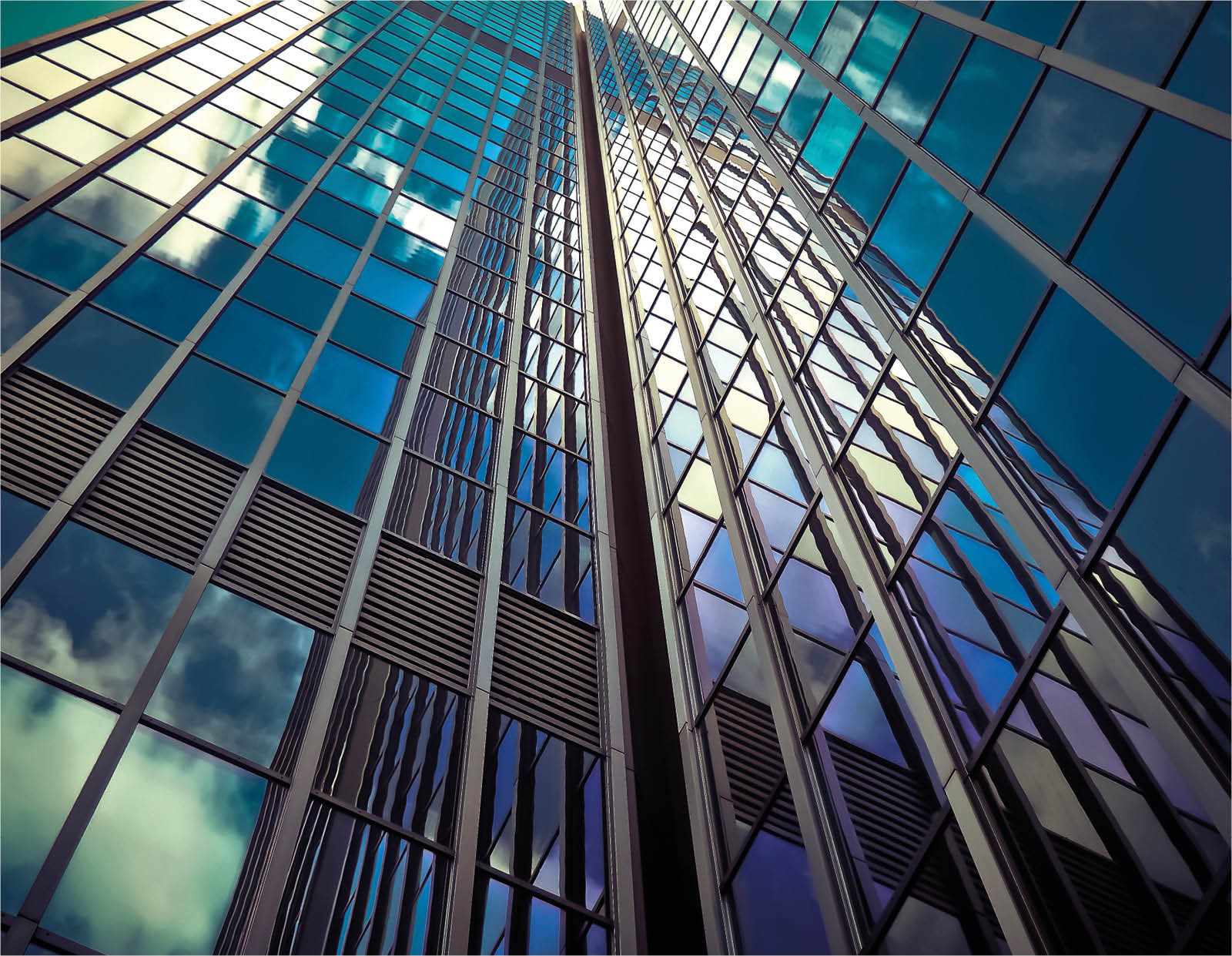 glass office buildings with sky reflection