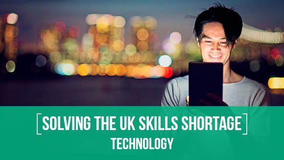 man on ipad at night looking at key insights in solving the uk skills shortage technology