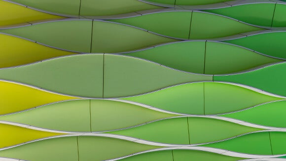 green and yellow horizontal waves on the side of a building