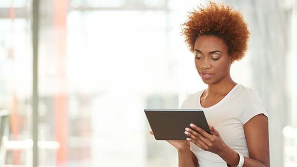 female on ipad working remotely female on ipad working remotely
