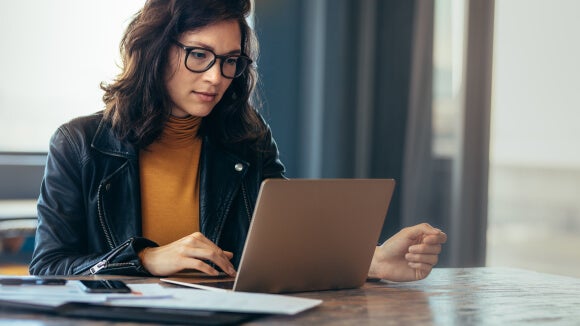 woman with glasses on laptop looking at changes to IR35 legislation