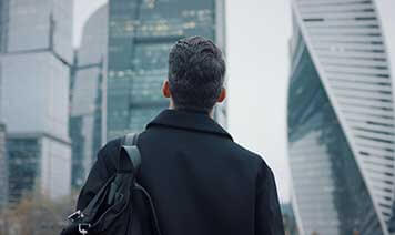 man looking at city