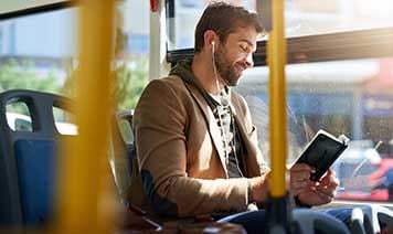 Man reading on bus