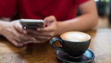 red shirt phone coffee
