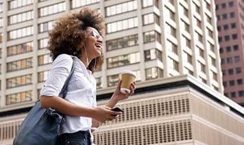 woman smiling building