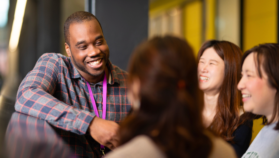 group of collegues smiling and talking